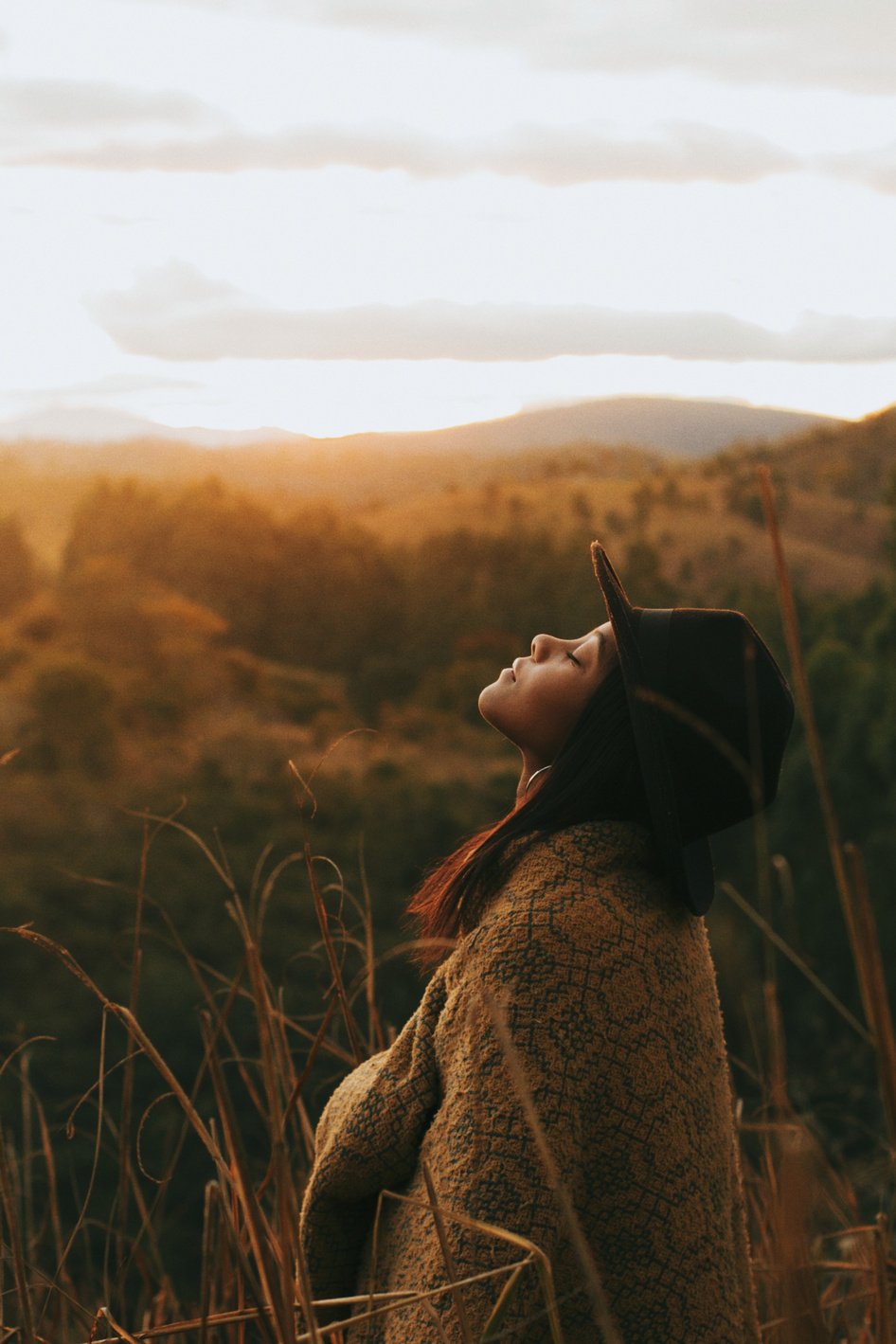 Woman Wearing Brown Cardigan and Black Hat